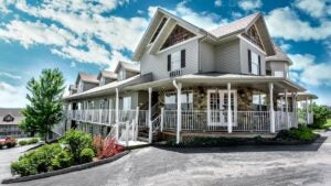 angled view of Gazebo Inn during day with blue sky and clouds in Branson, Missouri, USA